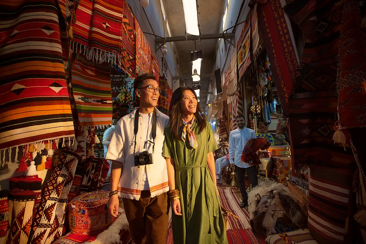 Couple shopping at Souq Al Badu‎ Market